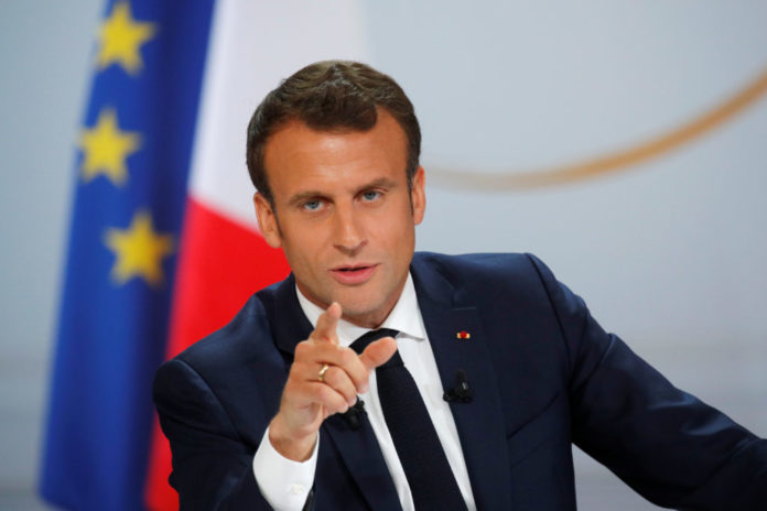 French President Emmanuel Macron speaks during a news conference to unveil his policy response to the yellow vests protest, at the Elysee Palace in Paris
